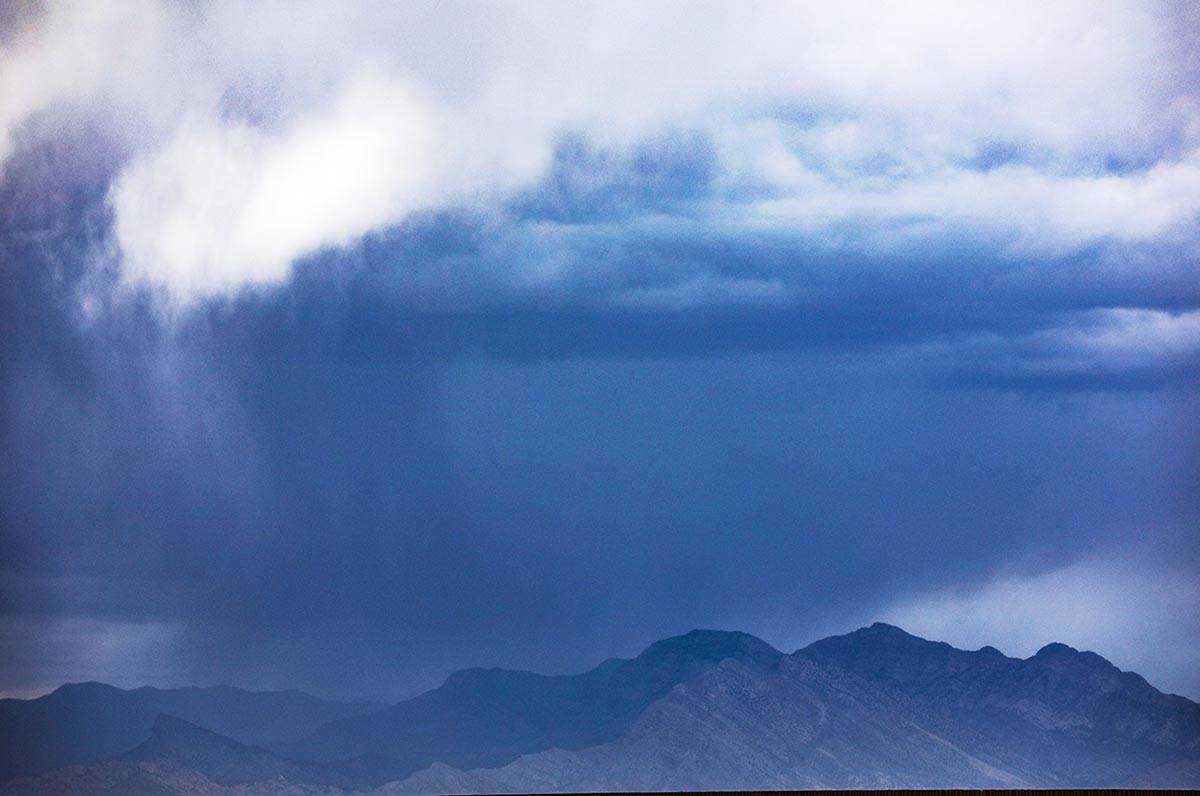 Storm clouds above mountains at the edge of Summerlin Sunday, May 16, 2021. Isolated thundersto ...
