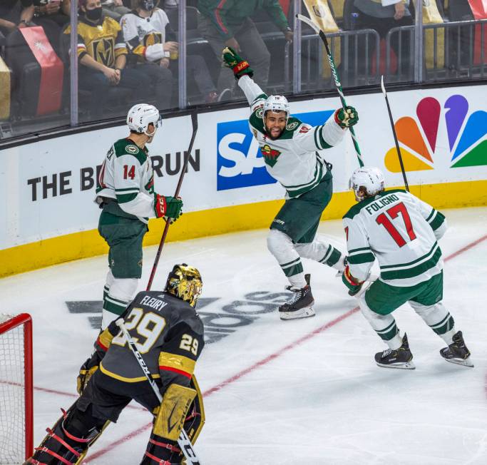 Minnesota Wild center Joel Eriksson Ek (14), celebrates his winning goal with teammates left wi ...