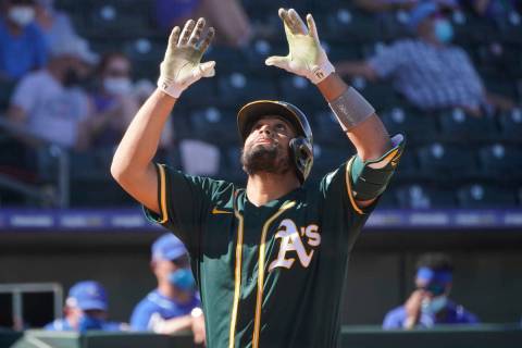 Oakland Athletics' Francisco Pena gestures as he crosses the plate with a home run in the sixth ...