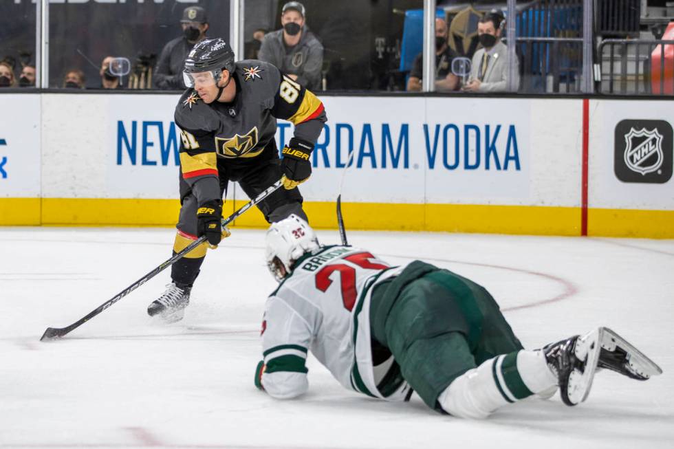 Golden Knights center Jonathan Marchessault (81) looks to shoot asMinnesota Wild defenseman Jon ...