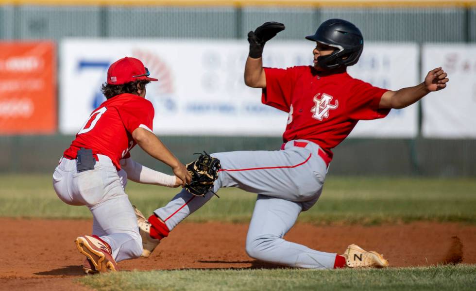 Liberty infielder Dylan Fisher (30) tags out Arbor View runner (3) during the third inning of a ...