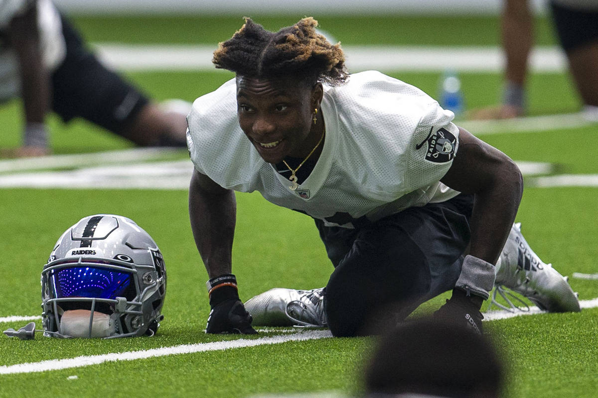 Las Vegas Raiders wide receiver Henry Ruggs III (11) stretches during a practice session at the ...