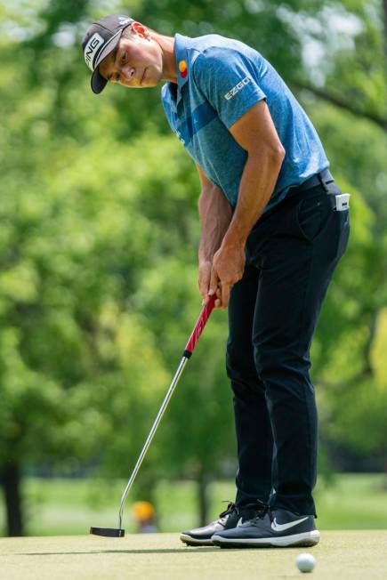 Viktor Hovland putts the ball on the third hole during the fourth round of the Wells Fargo Cham ...