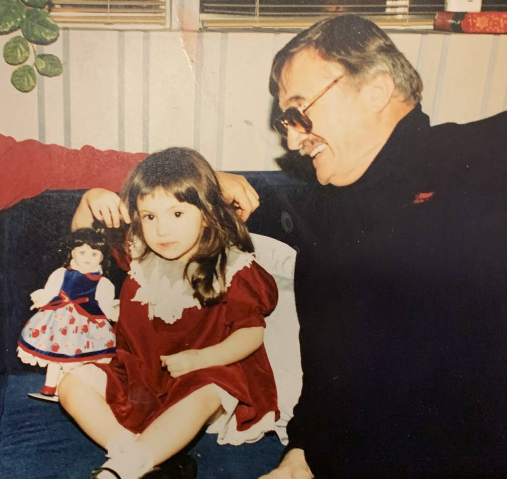 Retired Marine Peter "Chris" Christoff is pictured in 1995 smiling at 2-year-old Sarah Ann Mill ...