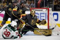 Golden Knights goaltender Marc-Andre Fleury (29) saves a shot on goal by Wild right wing Ryan H ...
