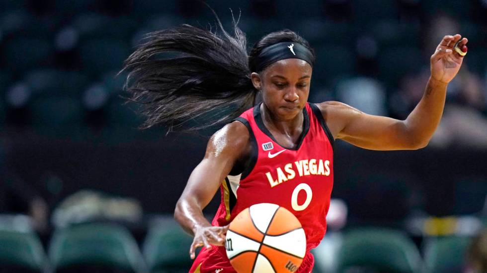 Las Vegas Aces' Jackie Young in action against the Seattle Storm during a WNBA basketball game ...