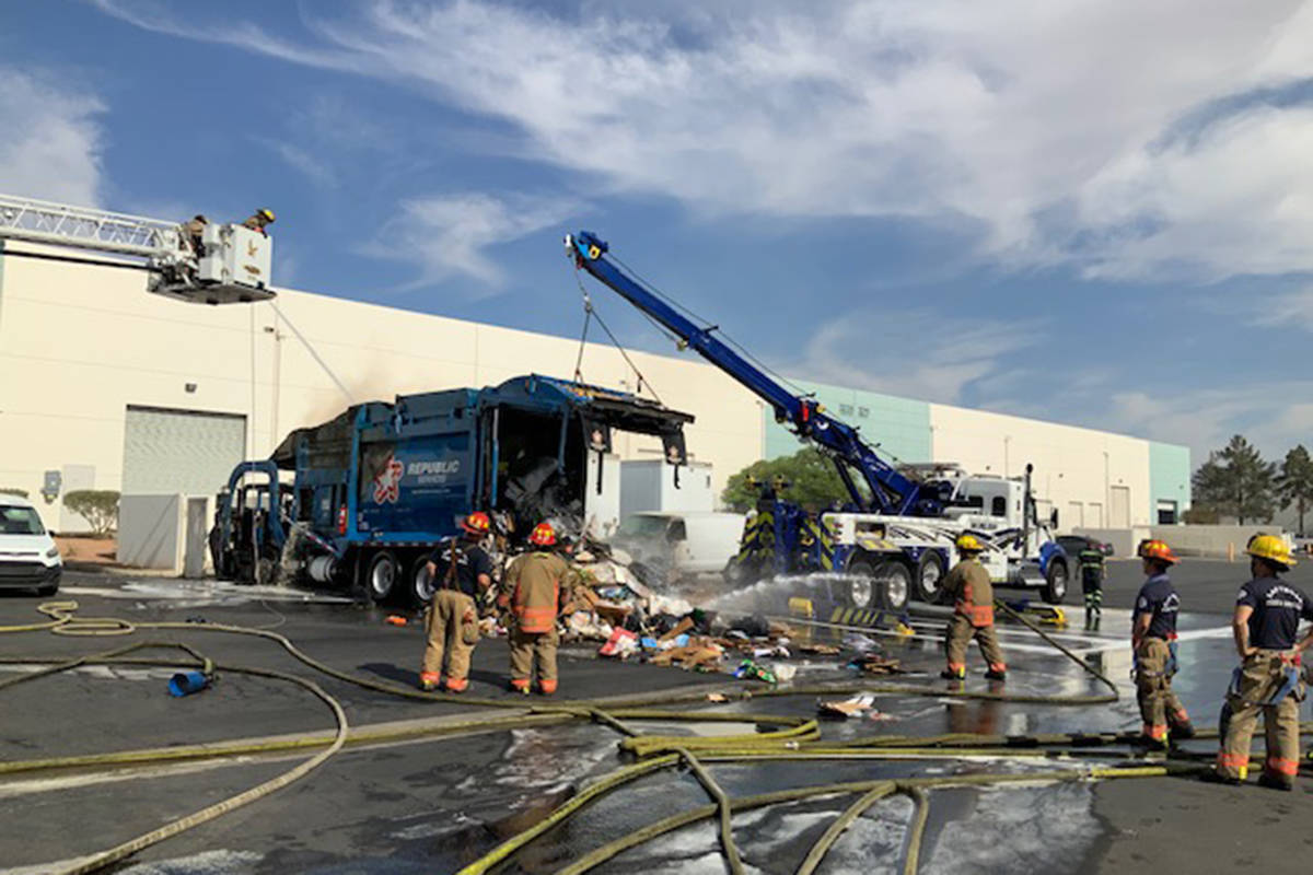 Crews battle a truck fire Wednesday, May 19, 2021, at 3210 E. Charleston Blvd. in Las Vegas. (L ...