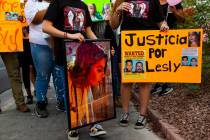 Family members hold pictures of Lesly Palacio, who was found slain near Valley of Fire State Pa ...