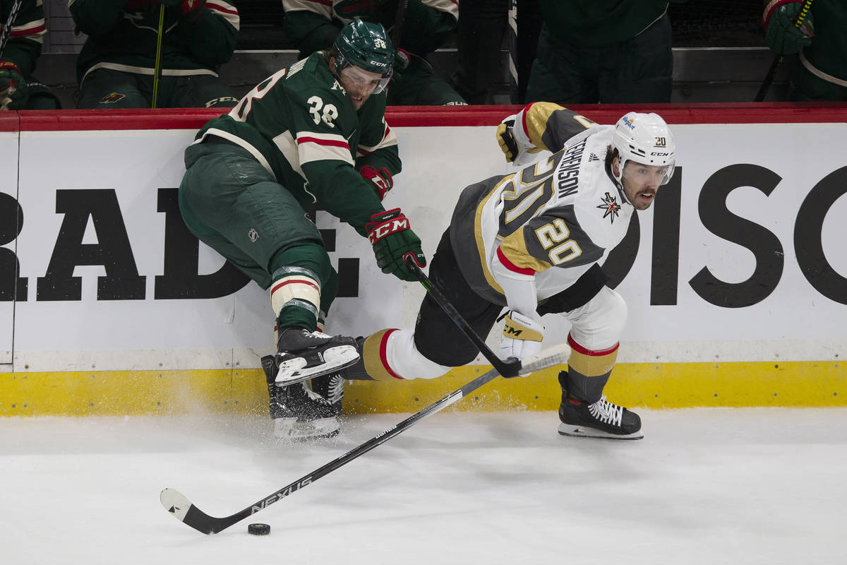 Vegas Golden Knights' Chandler Stephenson (20) gains control of the puck against Minnesota Wild ...