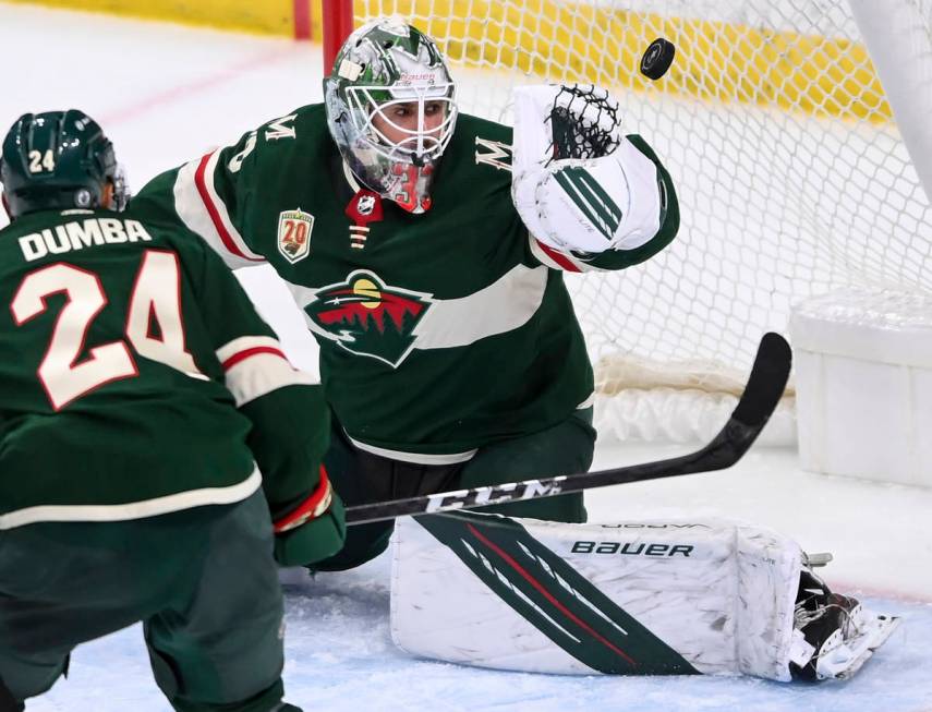 A shot by Vegas Golden Knights center Patrick Brown goes past the glove of Minnesota Wild goalt ...