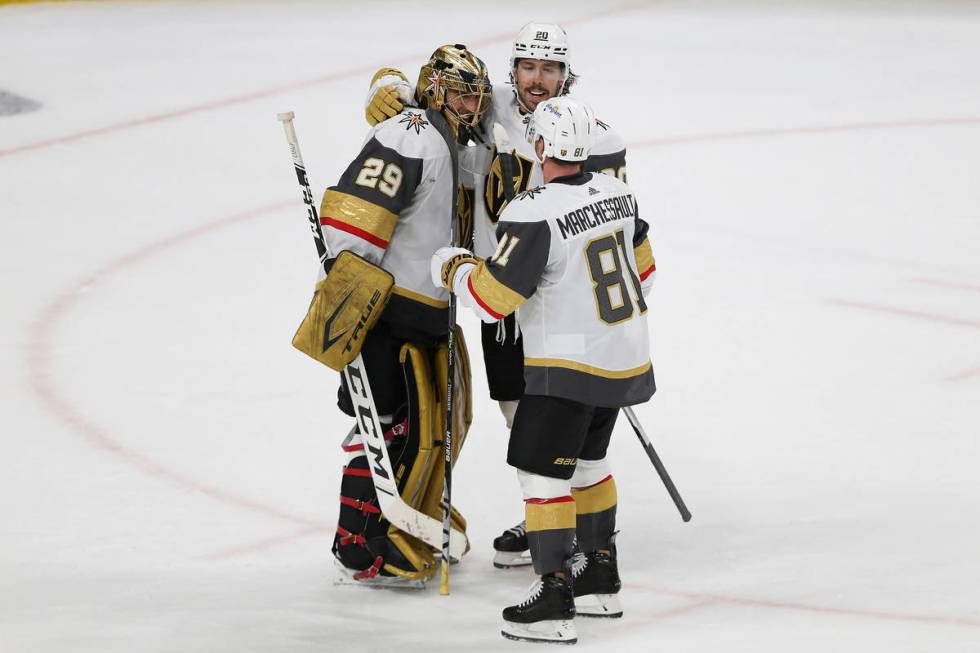 Vegas Golden Knights goalie Marc-Andre Fleury (29) celebrates with Chandler Stephenson (20) and ...