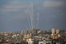 Rockets are launched from the Gaza Strip towards Israel, in Gaza City, Thursday, May 20, 2021. ...