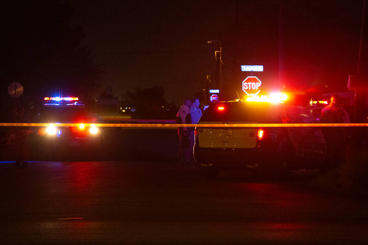 Metropolitan police investigate a homicide on the 3400 block of Center Drive, near East Charles ...