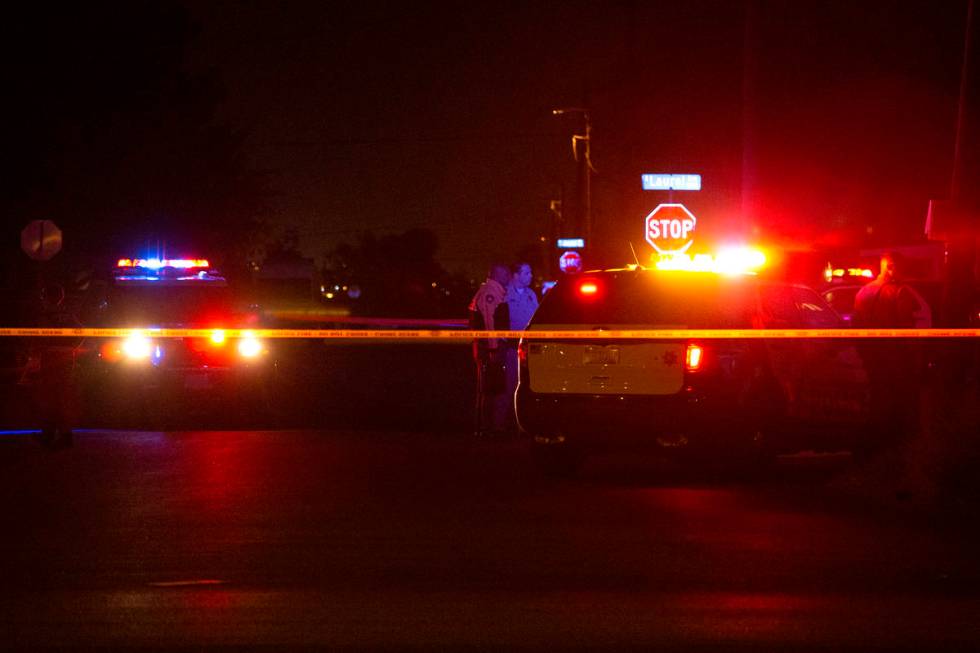 Metropolitan police investigate a homicide on the 3400 block of Center Drive, near East Charles ...