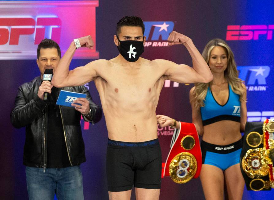 Jose Ramirez poses on the scale during a weigh-in at the Virgin Hotel in Las Vegas, Friday, May ...