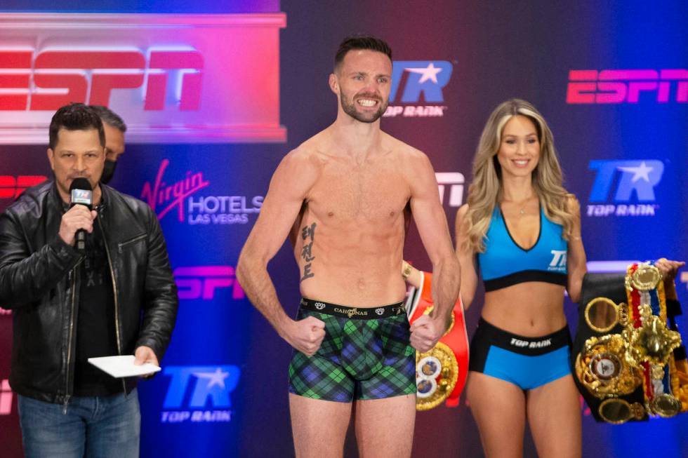 Josh Taylor poses on the scale during a weigh-in at the Virgin Hotel in Las Vegas, Friday, May ...