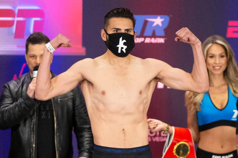 Jose Ramirez poses on the scale during a weigh-in at the Virgin Hotel in Las Vegas, Friday, May ...