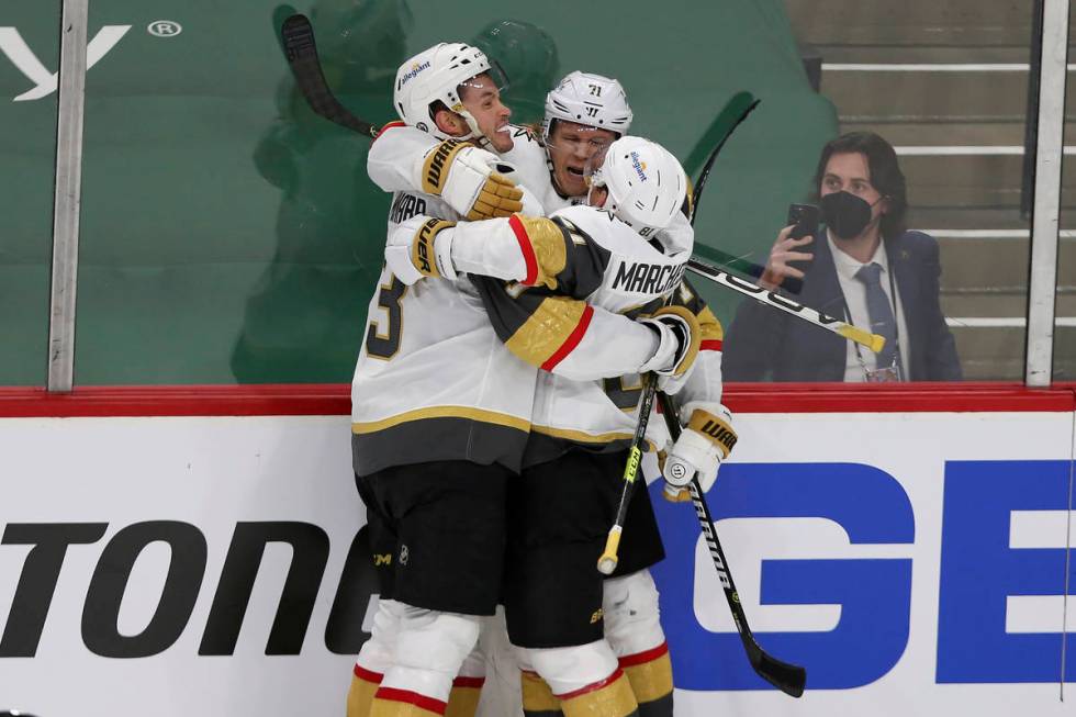 Vegas Golden Knights' William Karlsson, center, celebrates with teammates, including Jonathan M ...