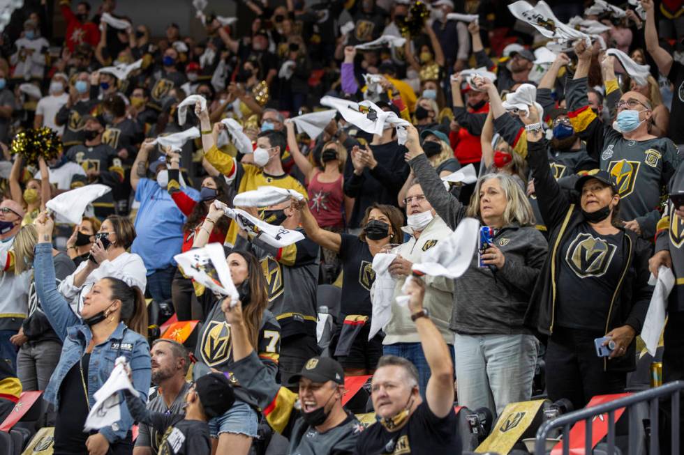 Golden Knights cheer on their team versus the Minnesota Wild during the first period of an NHL ...