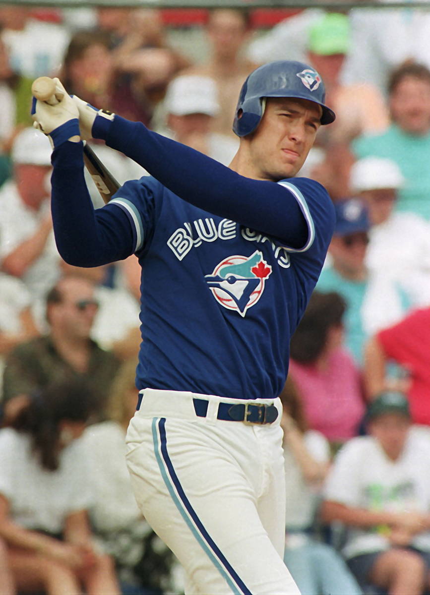 This March 21, 1992, photo shows Toronto Blue Jays first baseman John Olerud swinging through a ...