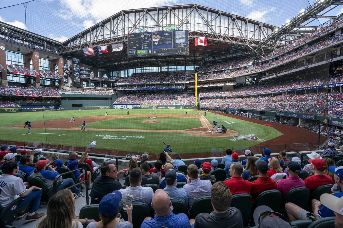 Fans fill the stands at Globe Life Field during the first inning of a baseball game between the ...