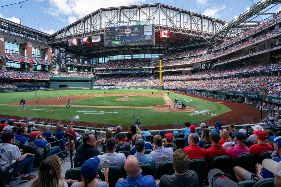 Fans fill the stands at Globe Life Field during the first inning of a baseball game between the ...