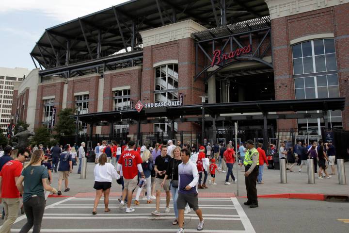 Fans make their way into Truist Park for the baseball game between the Atlanta Braves and the P ...