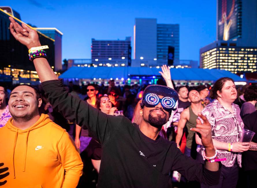 Jahi Cooke dances in a large crowd during Insomniac presents Deadmau5 at The Downtown Las Vegas ...