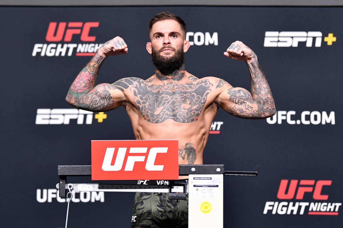 Cody Garbrandt poses on the scale during the UFC Fight Night weigh-in at UFC APEX on May 21, 20 ...