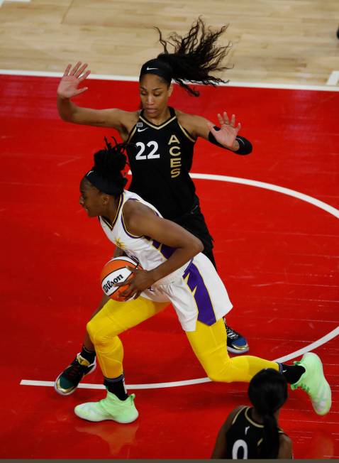 Los Angeles Sparks forward Nneka Ogwumike (30) tries to drive past Las Vegas Aces forward A'ja ...