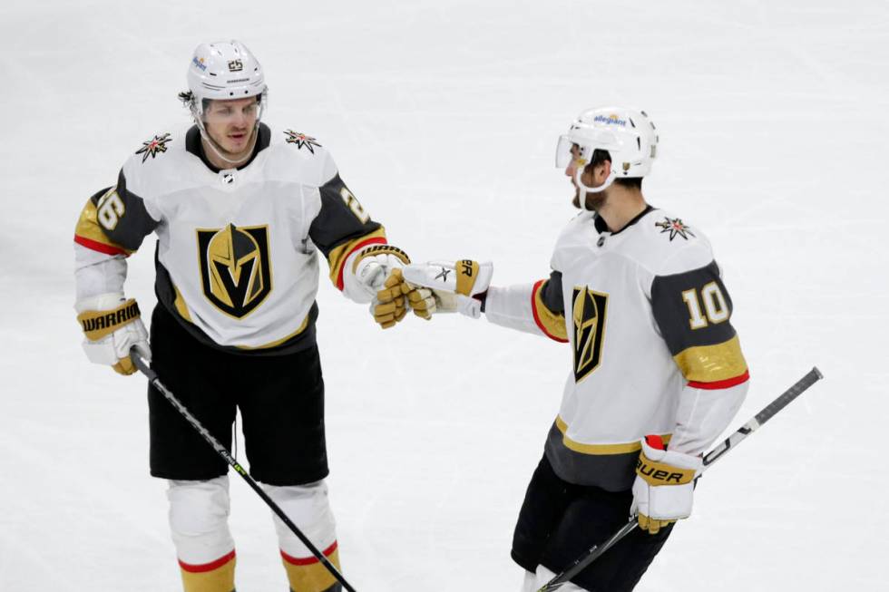 Vegas Golden Knights center Nicolas Roy (10) is congratulated by Mattias Janmark (26) after sco ...