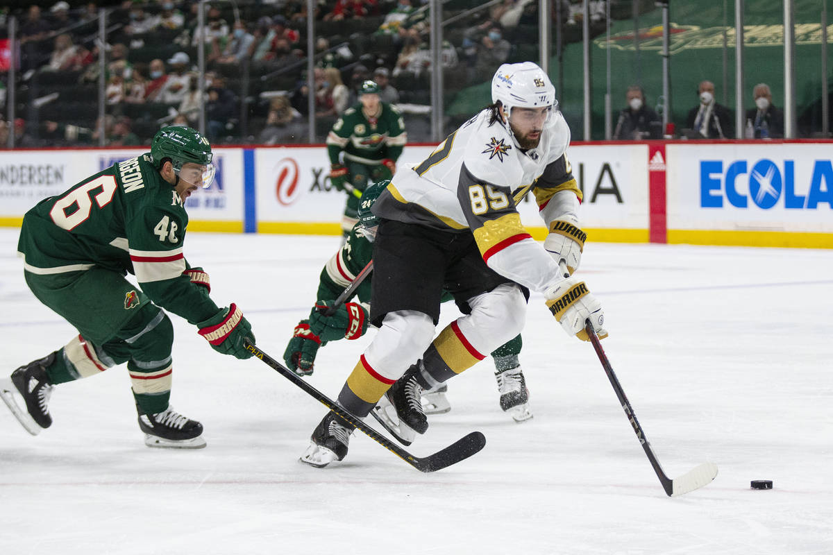 Vegas Golden Knights right wing Alex Tuch (89) breaks away from Minnesota Wild defenseman Jared ...