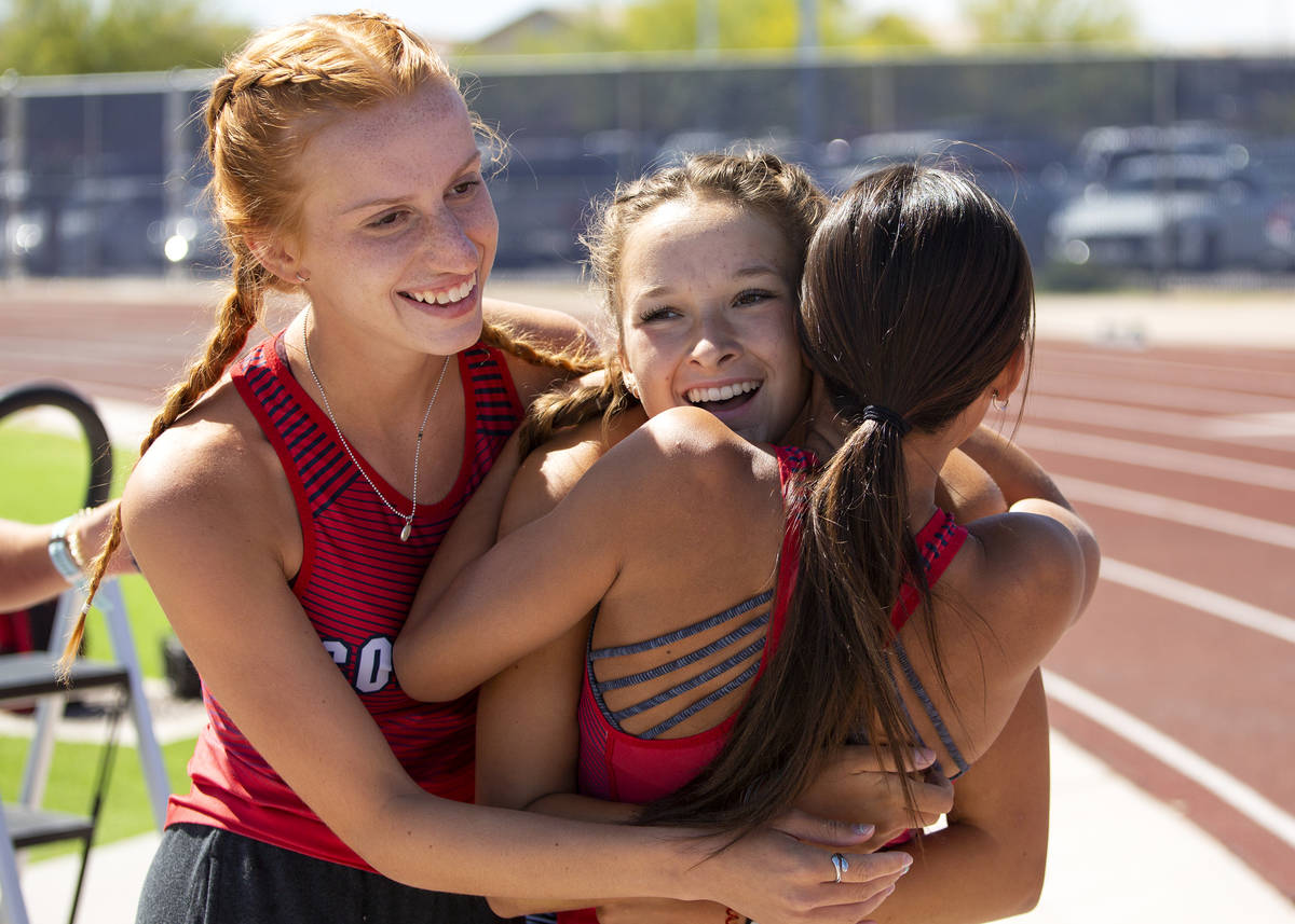 Coronado's Erin Shannon, center, is hugged by her teammates after winning the girls 800 meter r ...