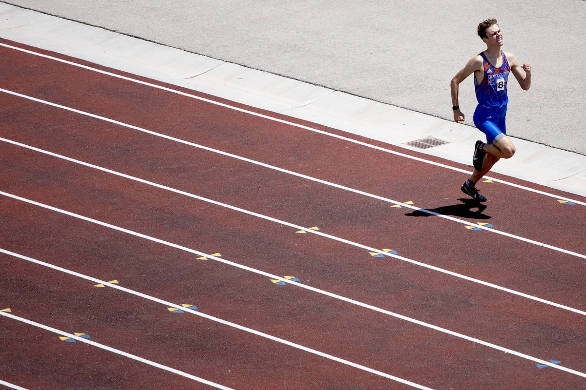 Bishop Gorman's Andrew Specht pushes toward a win and the finish line during the class 5A South ...