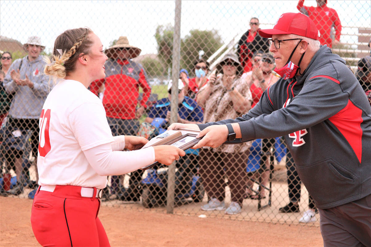 Arbor View athletic director Jay Howard hands the Class 5A Southern Region tournament champions ...