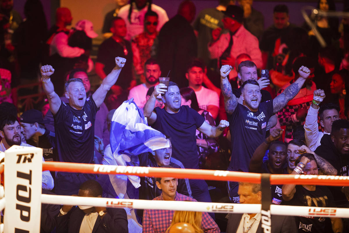 Fans of Josh Taylor celebrate after he defeated José Ramírez by unanimous decision du ...