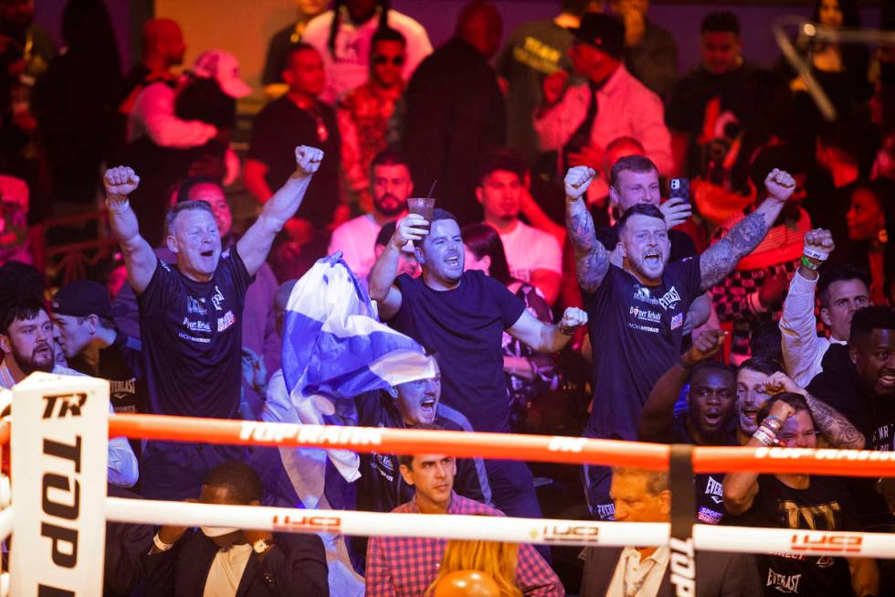 Fans of Josh Taylor celebrate after he defeated José Ramírez by unanimous decision du ...