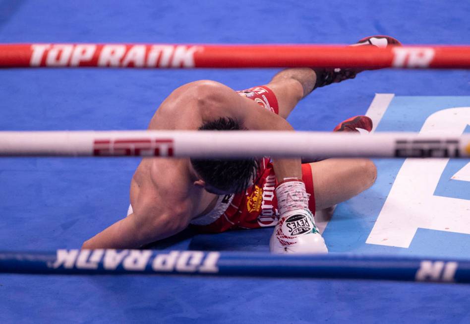 JosŽ Ram’rez is knocked down by Josh Taylor (out of frame) in the 7th round of the ...