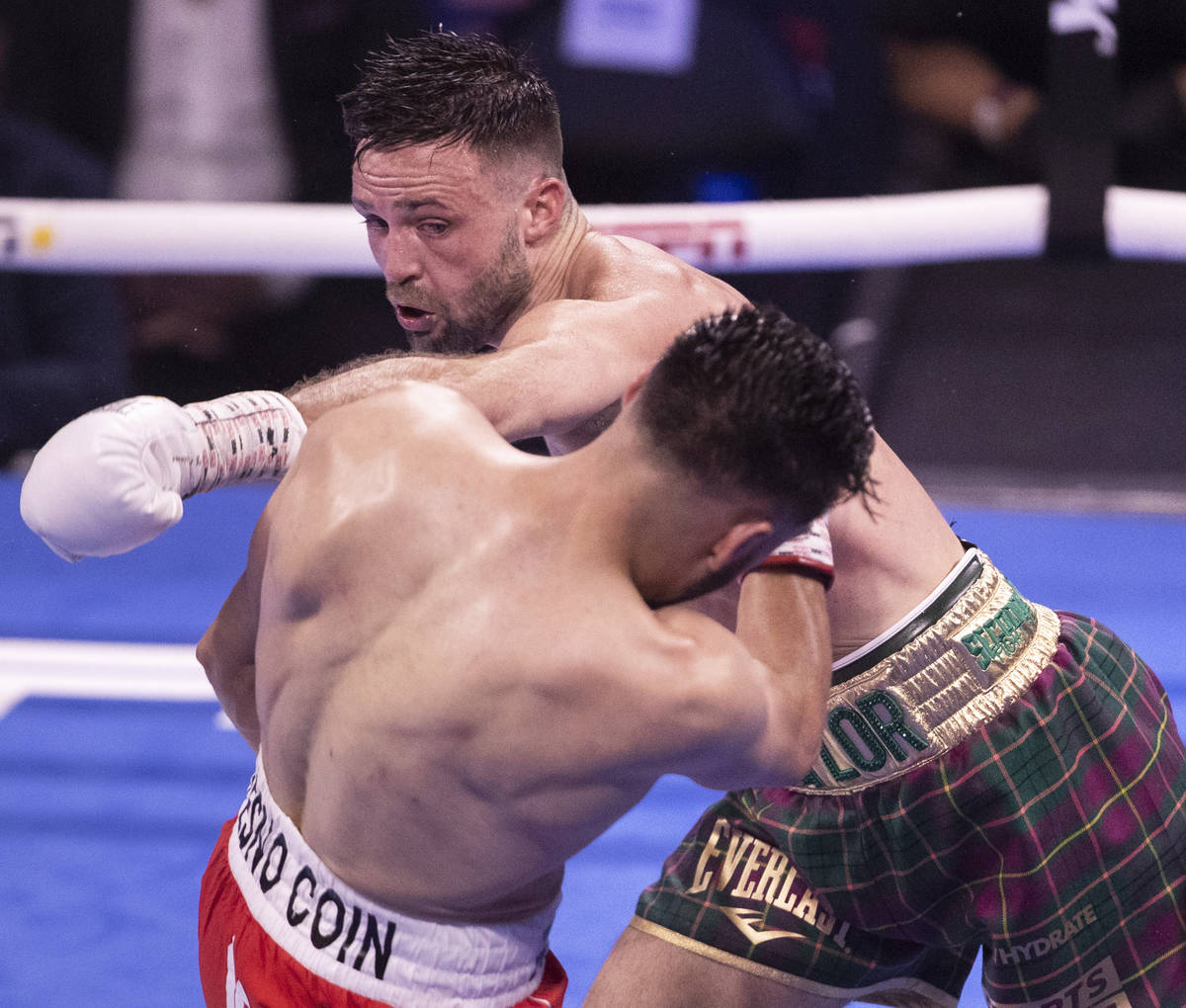 Josh Taylor, top/right, hits JosŽ Ram’rez during the 4th round of their junior wel ...