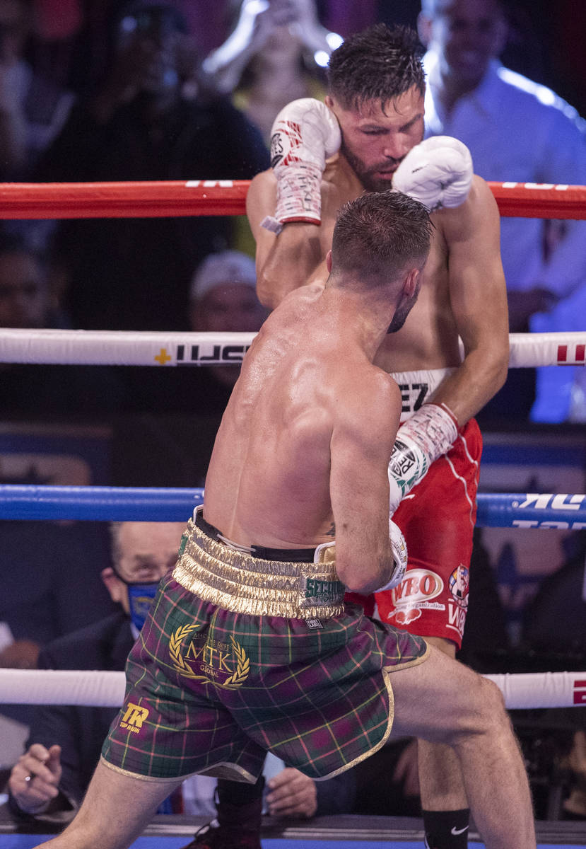 Josh Taylor, front, hits José Ramírez during the 7th round of their junior welterweig ...