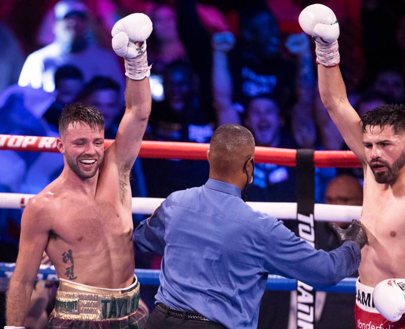 Josh Taylor, left, and JosŽ Ram’rez celebrate at the end of the 12th round of thei ...