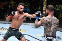 Rob Font punches Cody Garbrandt in their bantamweight bout during the UFC Fight Night event at ...