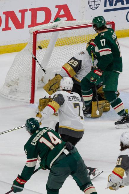 Minnesota Wild center Joel Eriksson Ek (14) scores a goal which was negated on an interference ...
