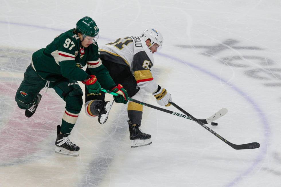 Minnesota Wild left wing Kirill Kaprizov (97) and Vegas Golden Knights center Jonathan Marchess ...