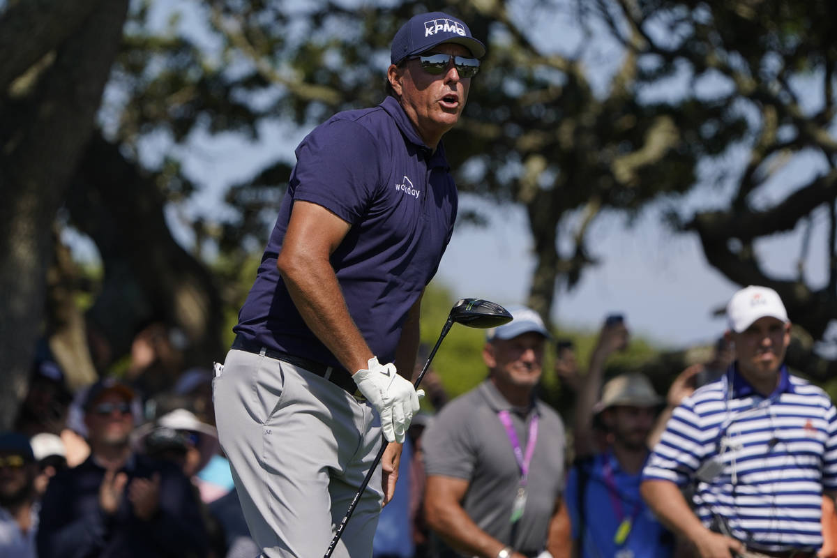 Phil Mickelson watches his ball from the seventh tee during the final round at the PGA Champion ...