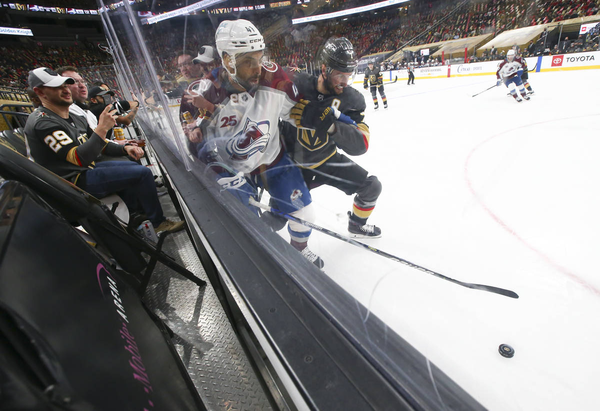 Colorado Avalanche's Pierre-Edouard Bellemare (41) and Golden Knights' Alex Pietrangelo (7) bat ...