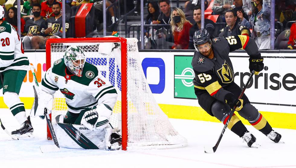 Golden Knights' Keegan Kolesar (55) skates with the puck as Minnesota Wild goaltender Cam Talbo ...