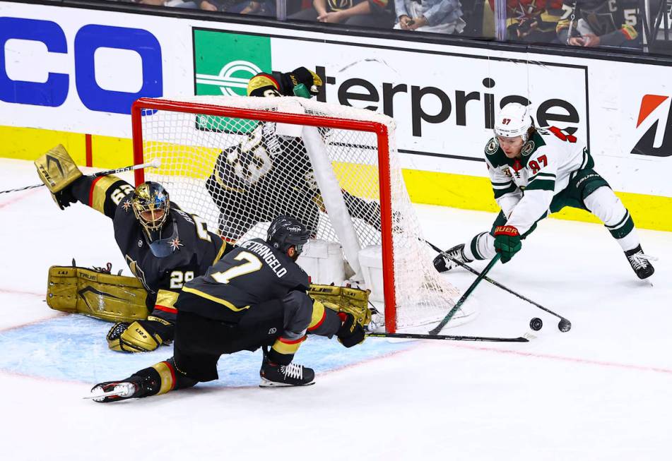 Minnesota Wild's Kirill Kaprizov (97) tries to get the puck past Golden Knights' Alex Pietrange ...