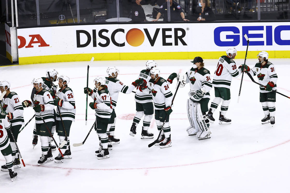 The Minnesota Wild celebrate their Game 5 win over the Golden Knights in a first-round NHL hock ...
