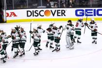 The Minnesota Wild celebrate their Game 5 win over the Golden Knights in a first-round NHL hock ...